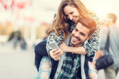 stock-photo-67514965-man-carrying-his-girlfriend-on-piggyback-for-selfie